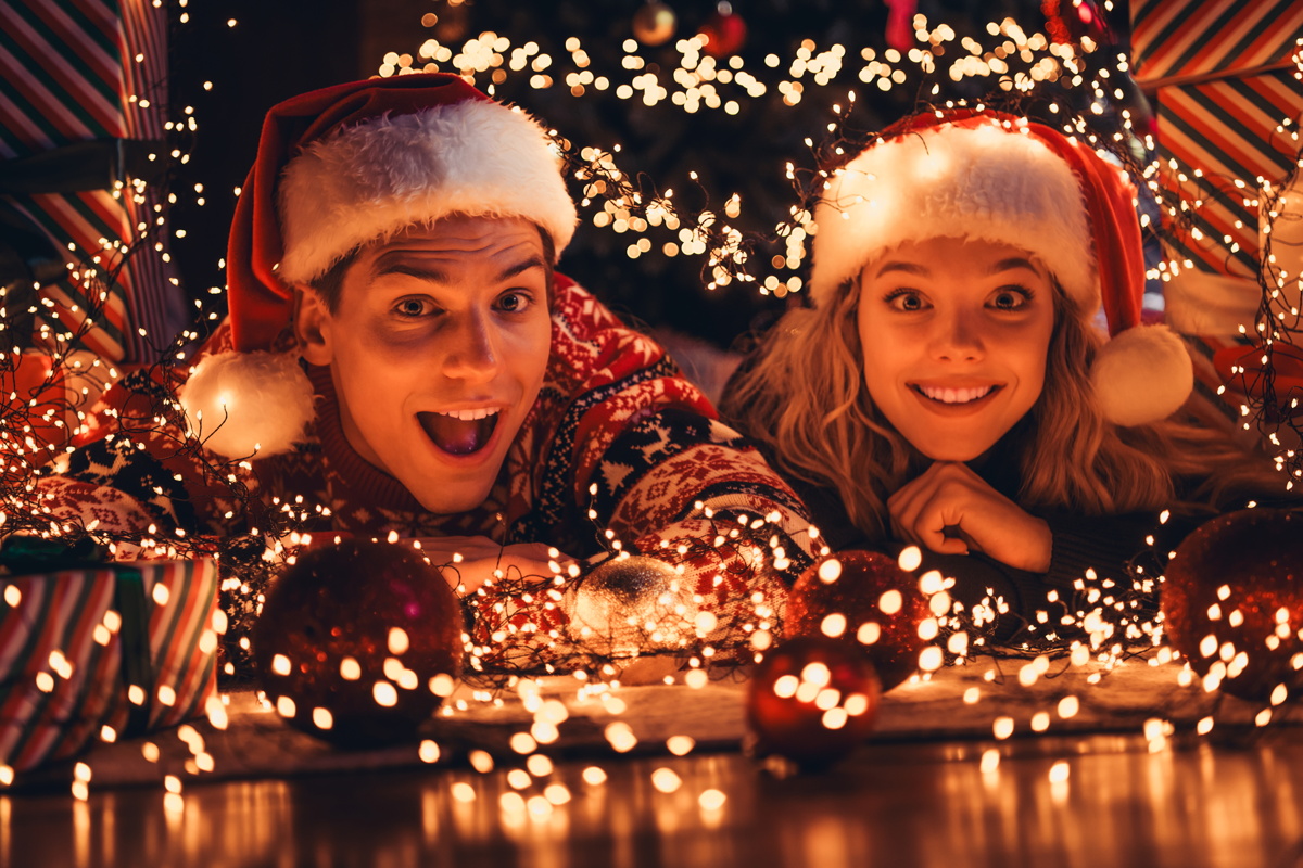 People among Christmas lights