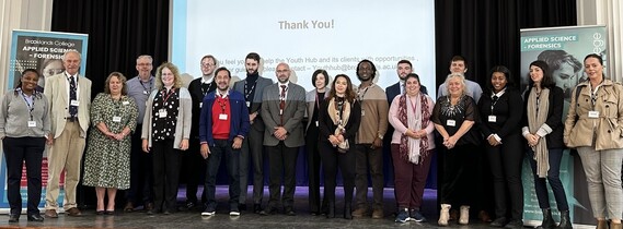 The Leader of the council standing with members of the Youth Hub