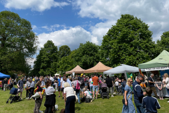 People at an outdoor market in Elmbridge
