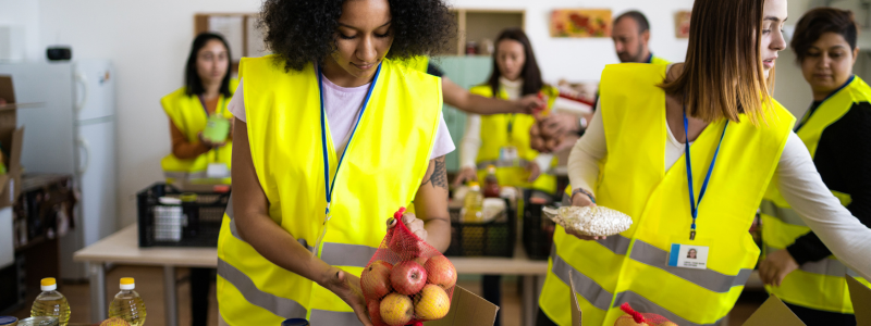 Volunteers packing food to hand out to community 