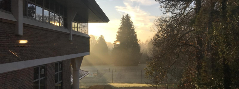 Elmbridge Civic Centre and tennis courts on a misty morning