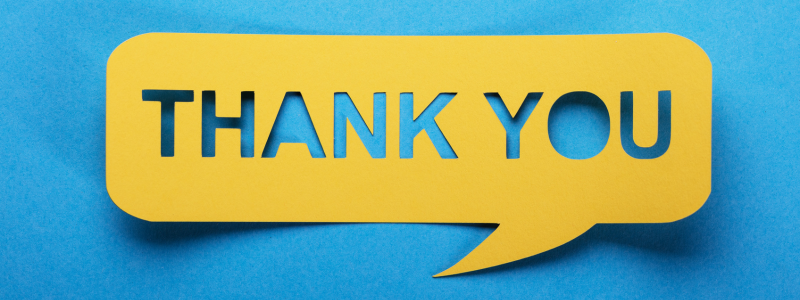 Thank you written in a yellow speech bubble on a blue background