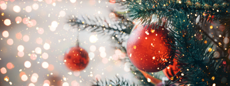 Christmas tree with lights and red baubles