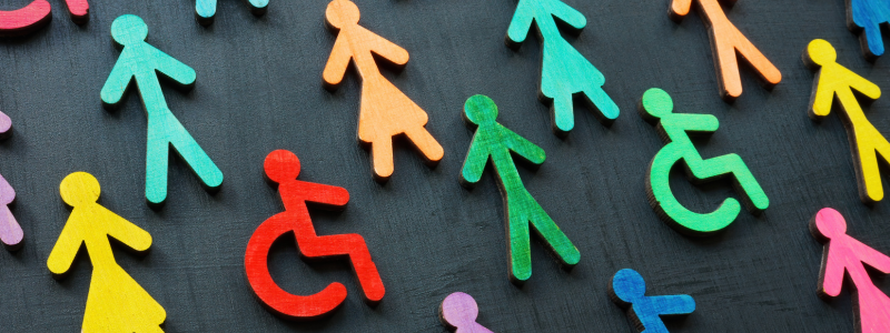 Black background with colourful stick people including people in wheelchairs