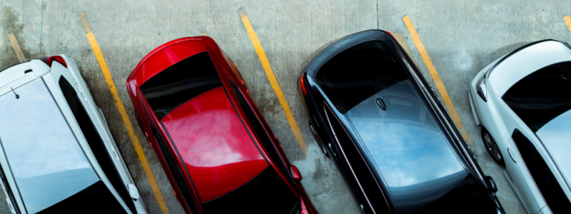 Rows of cars lined up in a car park