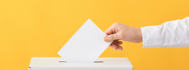 Ballot box on yellow background