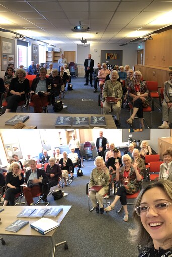 group of people sitting on chairs at the AGM