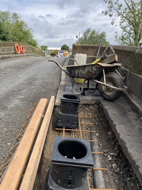 Bollards being installed along the bridge