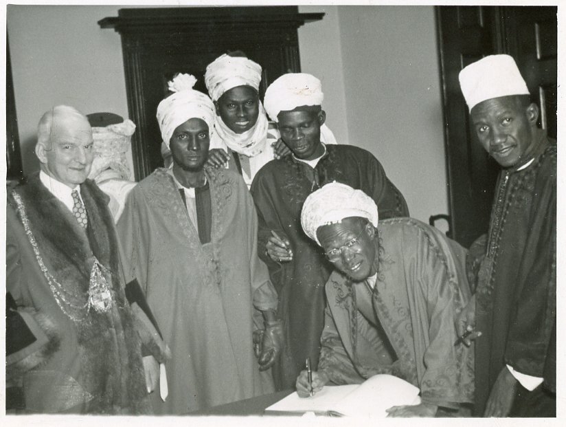 Group of people signing a document