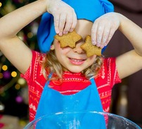 child holding star-shaped biscuits