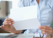 person reading a letter