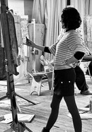 Person stood next to an easel 