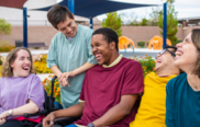 A photo of young people with disabilities smiling