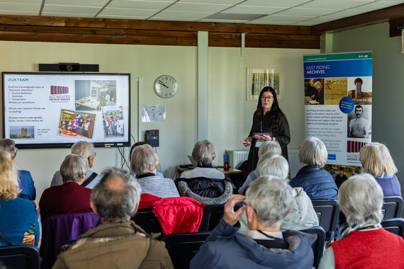 A person giving a talk to an audience.
