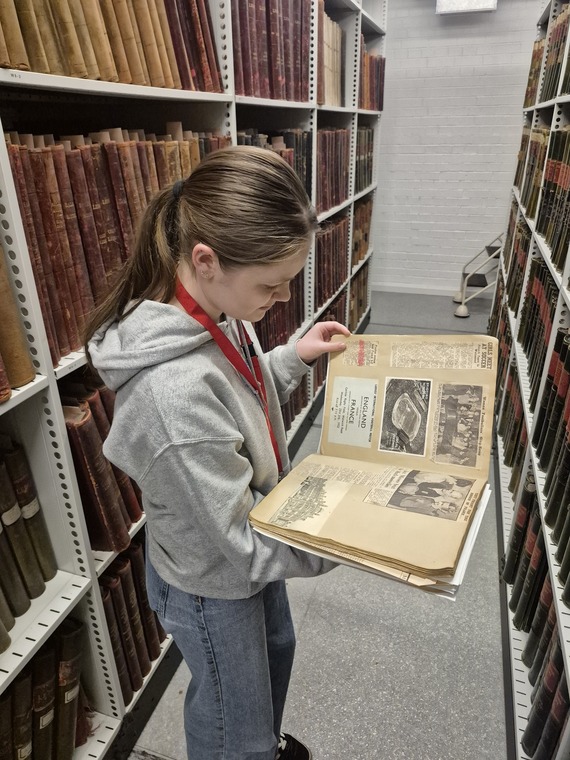 Person looking at a historic document