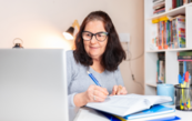 A photo of a woman learning on a laptop