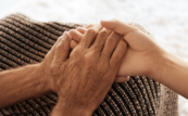 A photo of people holding hands