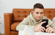 A photo of a young person using a smart phone
