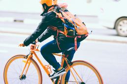 Woman cycling to work