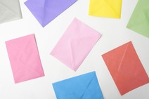 colourful envelopes lying on a white background