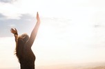 Image of woman with raised hands
