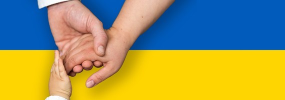 Hands joined over Ukraine flag