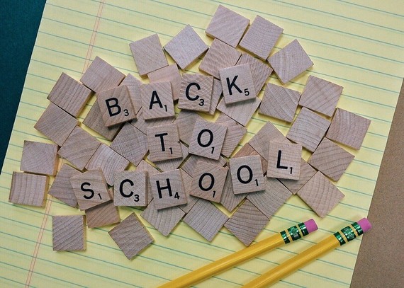 Scrabble tiles spell out the words 'back to school'