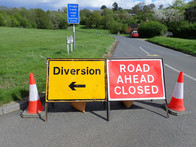 Road ahead closed and diversion signs