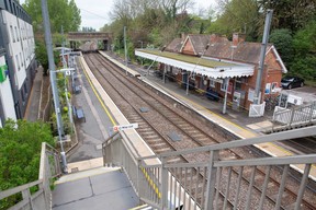 View of Whittlesford Parkway station platform and train line taken from the bridge over the tracks
