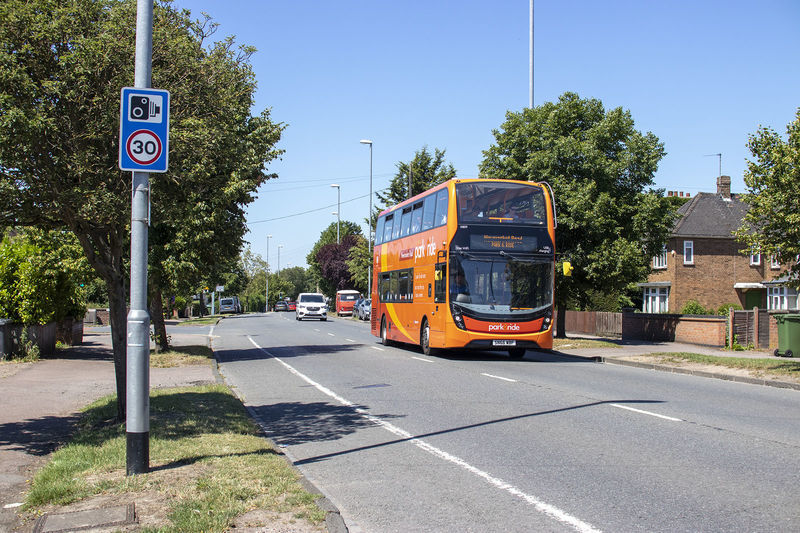 Front on image of a Park and Ride bus travelling down the road