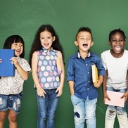 Children holding school items