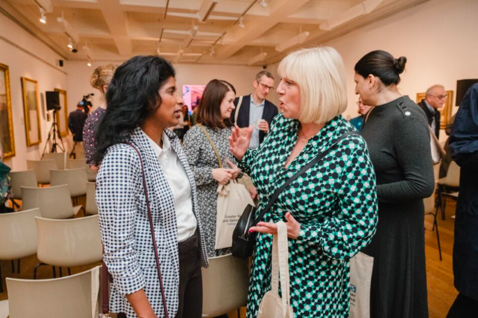 Photo of two women talking 