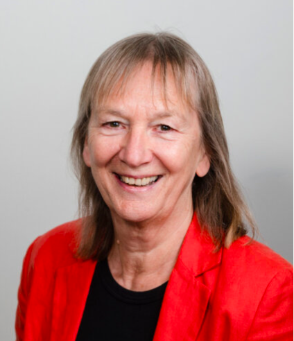 Photo of a woman in red top and blazer