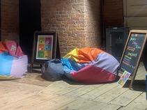 Camerados Public Living Room sign and bean bags