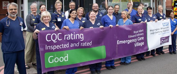 Staff from Wigan hospital holding up their CQC banner