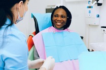 Woman sitting in dentists chair