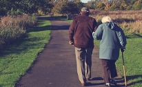 Two people walking down a path