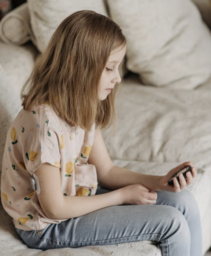 A girl checking her blood sugar reading