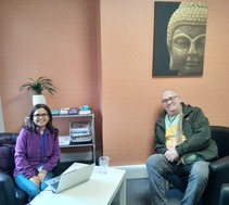 Two people talking - Jyoti and one of the people she is working with 