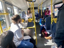 People sat on a bus for a breakout session