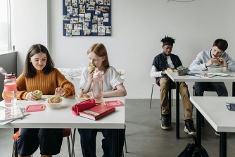 Children eating lunch in a classroom