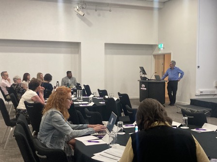 Clinical director Dr Peter Elton speaking at the event