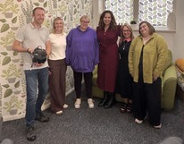 ITV cameraman with group of females smiling