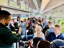 a bus full of people being interviewed