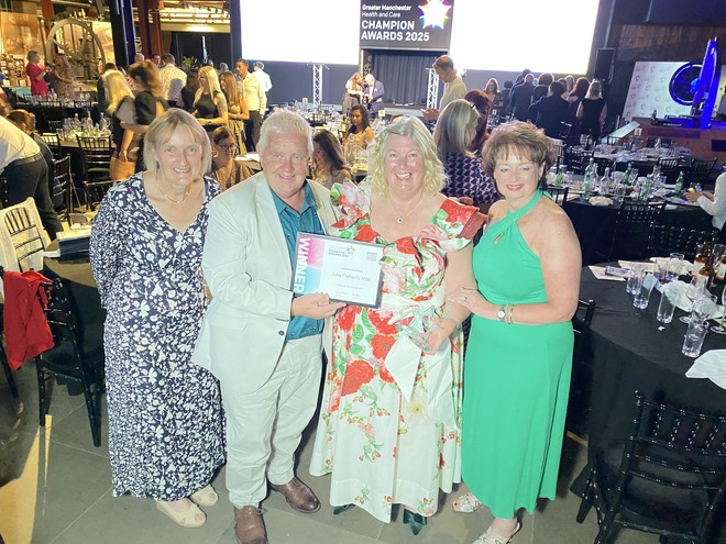 Photo of Julie Flaherty and friends and her lifetime achievement award