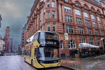 Bee Network Bus outside Tootal Buildings in Manchester
