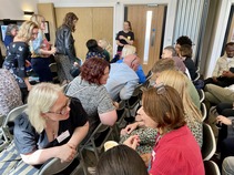 Group of people talking to each other