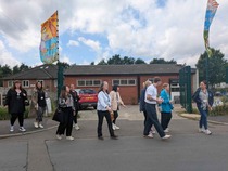 Flags and pathfinder leads walking outside Ridgehill community centre