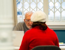 Two people working together at Stretford Public Hall