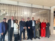 a line of people stood together smiling